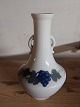 Early art 
nouveau 
porcelain vase 
from Royal 
Copenhagen with 
handle. In the 
middle of the 
vase ...