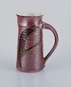 Stouby Keramik, 
Denmark, a 
handmade 
ceramic jug 
with glaze in 
brown and sandy 
...