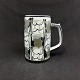 Height 13 cm.
Decoration 
number 
692/3697.
1. sorting.
The mug's 
decoration was 
designed ...
