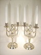 Candlesticks 
Messing.med 
woman who keeps 
lysarme.
 Height 30 cm
 from 1800 
first half 
century