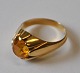 14 carat gold 
ring with 
yellow zitrin, 
20th century 
Denmark. 
Indistinctly 
stamped. Size: 
52. ...