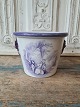 19th century 
English faience 
flower pot with 
lion heads as 
handle and 
manganese 
colored ...