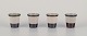 Bing & 
Grøndahl, 
"Tema". Four 
egg cups in 
stoneware.
From the 
1970s.
Model: 696.
Marked.
In ...