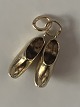 A pair of clogs 
pendant #14 
carat Gold
Stamped 585
Height 19.98 
mm
Width 11.27 mm
Nice and ...