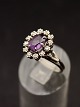 14 carat white 
gold ring size 
55 amethyst 
surrounded by 
zircons item 
no. 543380