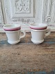 Pair of French 
café brûlot 
cups in strong 
iron porcelain 
decorated with 
bright red, 
black and ...
