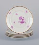 Bing & 
Grøndahl, 
Denmark. A set 
of five 
luncheon plates 
with flower 
decorations in 
purple and ...