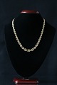 Beautiful and 
elegant 
necklace in 14 
carat solid 
gold, with a 
beautifully 
shaped link as 
a knot. ...