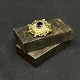 "Diameter" 3.5 
cm.
Nice brooch 
with cut purple 
stone in the 
middle from the 
1880s.
It is ...