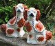 Giant 
Staffordshire 
dogs, mid 19th 
century 
England. 
Hand-painted 
earthenware 
with gilding. 
H.: ...