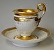 German empire 
porcelain 
coffee cup with 
saucer, 19th 
century. White 
porcelain with 
gilding. ...