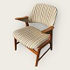 Teak wood chair 
with slightly 
curved 
armrests. Nice 
used condition. 
Danish modern 
from the 1960s.