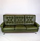 The 3-seater 
sofa in dark 
green leather 
with chrome 
legs from the 
early 1970s is 
a period and 
...