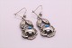 Beautiful 
earrings in 
silver, with 
beautiful 
details and a 
pendant with 
inlaid 
turquoise. 
These ...