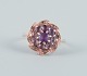 Danish 
goldsmith, 14 
karat gold ring 
adorned with a 
purple 
semi-precious 
stone. Art Deco 
...