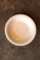 Old Swedish 
cream-colored 
earthenware 
bowl with pearl 
edge and a fine 
patina. Height: 
7.5cm. ...