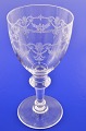 Wine glass with 
guilloche 
decoration on 
the bowl. 
Height 19.5 cm. 
Diameter 9.7 
cm. Fine ...