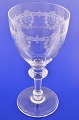 Wine glass with 
guilloche 
decoration on 
the bowl. 
Height 19.5 cm. 
Diameter 9.7 
cm. Fine ...