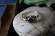 Beautiful gold 
ring in 8 
carats, with a 
beautiful blue 
stone. The ring 
is an elegant 
classic ...