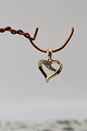 Beautiful and 
exclusive 
pendant in 14 
carat gold, 
perfect for a 
thin gold 
chain. The 
pendant has ...