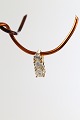 This small fine 
pendant is a 
nice detail 
around the 
neck, where it 
would be in a 
thin gold ...