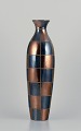 French ceramic 
artist. Large 
unique ceramic 
vase in a 
modernist 
design.
Square 
sections in 
blue ...