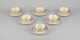 A set of six 
KP, Karlskrona 
(Sweden) tea 
cups with 
saucers in 
cream-colored 
porcelain with 
gold ...
