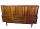 The tall 
sideboard in 
rosewood, 
designed by 
Johannes 
Andersen and 
produced by 
Skaaning ...