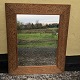 Mirror in 
wooden frame, 
The frame with 
many cutouts. 
Dimensions: 
61x75 cm