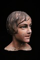 Decorative, old 
mannequin head 
of a woman from 
the 30s in 
painted plaster 
and papier 
mache with ...