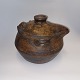 Sculptural 
Moroccan pot 
with lid for 
cooking. 
Beautiful 
patina and 
several traces 
of use, which 
...