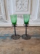 Pair of Art 
Nouveau shot 
glasses. The 
cup is made of 
ground green 
glass mounted 
on a pewter ...