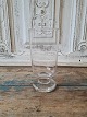 Smooth Porter 
glass on a low 
thick base, 
produced at 
Holmegaard 
glassworks from 
1900
Height 15 cm.