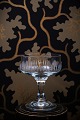 Old champagne 
glass / bowl 
with a fine 
single ground 
pattern on the 
side of the 
glass. H: 11cm. 
...
