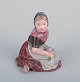 Royal 
Copenhagen, 
regional 
figurine of a 
girl from Faroe 
Islands. 
Overglaze. 
Dressed in 
regional ...