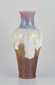 Sevres, France. 
Large unique 
porcelain vase 
with flowing 
glaze in ochre 
yellow, purple, 
and sand ...
