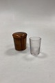 Travel Glass in 
wooden case 
with screw lid. 
The glass has 
cuts with 
motifs of 
mythical 
animals. ...