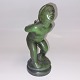 Figure I metal. 
Bronze 
patinated in a 
greenish 
colour. 
Depicting a 
naked girl 
hiding the 
scrub ...