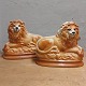 Staffordshire: 
Pair of figures 
of reclining 
lions in 
faiance with 
glass eyes. 
Made around 
1900 ...