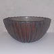 Raku-fired bowl 
in ceramics by 
Charlotte 
Nielsen. Has a 
small chip (see 
photo). 
Otherwise in 
...