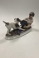 Dahl Jensen 
Figurine of 
wire haired 
Foxterrier dog 
in play with 
boy No 1072
Measures 
32,5cm / ...