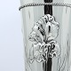 Tall silver 
vase in early 
Danish Art 
Nouveau style, 
decorated with 
flowers and 
twisted silver 
...