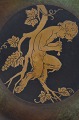 Just Andersen 
large table 
dish of 
patinated 
bronze, 
decorated with 
a motif of a 
faun. Signed 
...