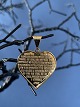 14 carat heart 
pendant 
engraved with 
the Lord's 
Prayer 
symbolizes both 
faith and ...