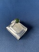 A lady's silver 
ring with green 
jade, made in 
sterling 
silver,
a piece of 
jewelery that 
is both ...