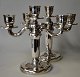 A pair of 
three-armed 
candlesticks, 
silver-plated. 
The 1930s. 
Denmark. 
Unstamped. H. 
23 cm. W. ...