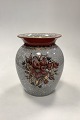 Dahl Jensen 
Cracked Glaze 
Vase No. 
102/593. 
Decoration in 
siena red, 
white and gold. 
Measures ...
