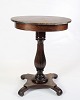 This elegant 
side table is a 
beautiful 
example of 
furniture 
craftsmanship 
from the 19th 
century, ...