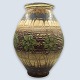 Kähler floor 
vase. Patterned 
in dark brown, 
beige, and blue 
glaze. With 
decoration of 
leaves in ...