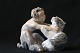 Beautiful 
porcelain 
figurine from 
Royal 
Copenhagen, 
depicting a 
faun with a 
cat. The figure 
is ...